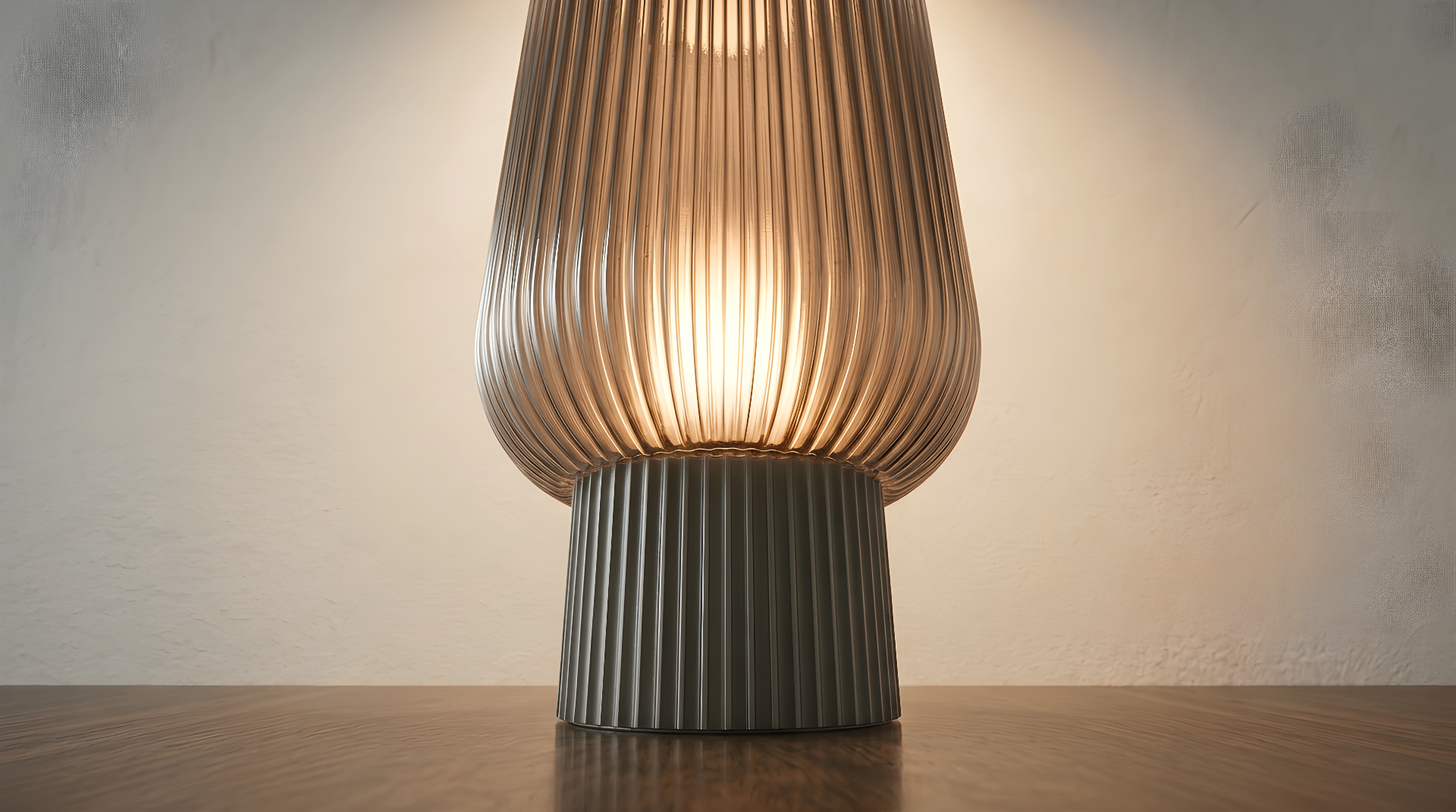 The Altus table lamp lit, close crop of shade and base