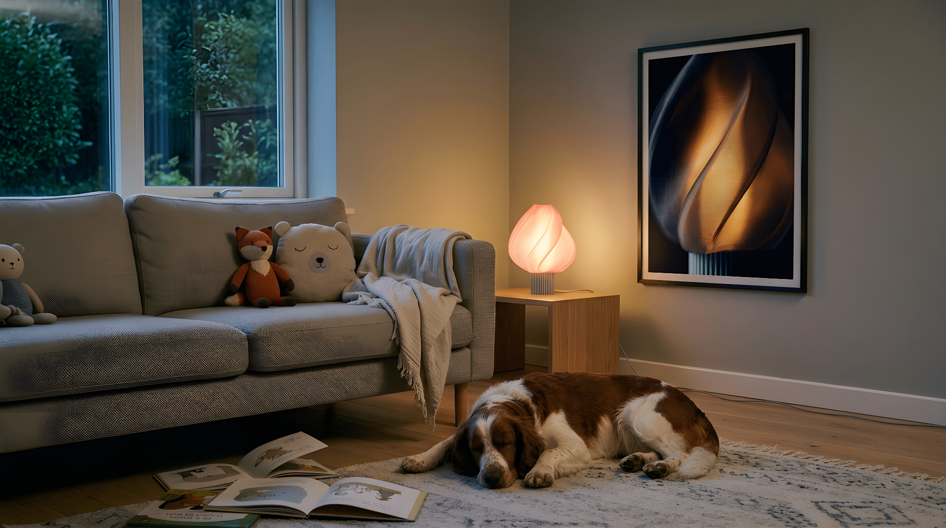 The Elysian table lamp glowing in a cozy living room