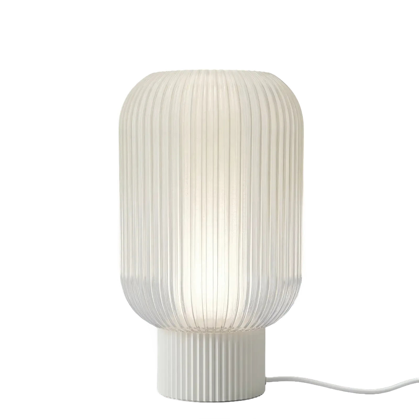 Altus table lamp with clear shade and chalk base, light lit
